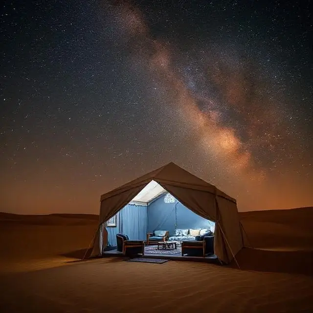 A luxurious tent under the stars in the Arabian desert.